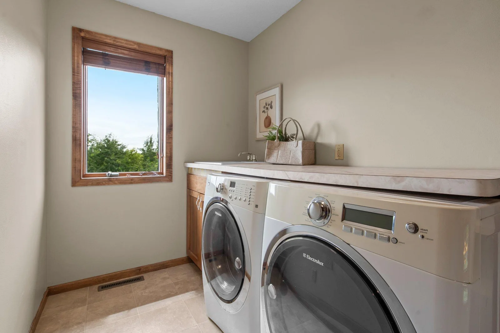 The laundry room is conveniently located on the upper level of the home.