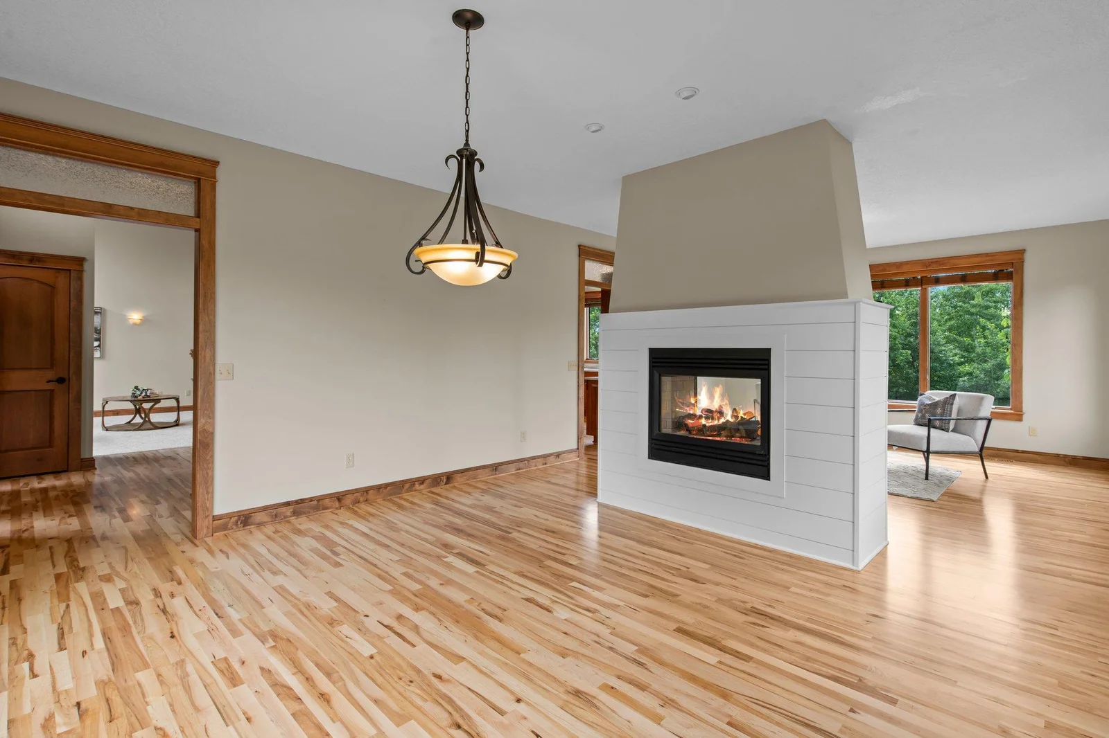 The double sided fireplace is the perfect centerpiece for this home.