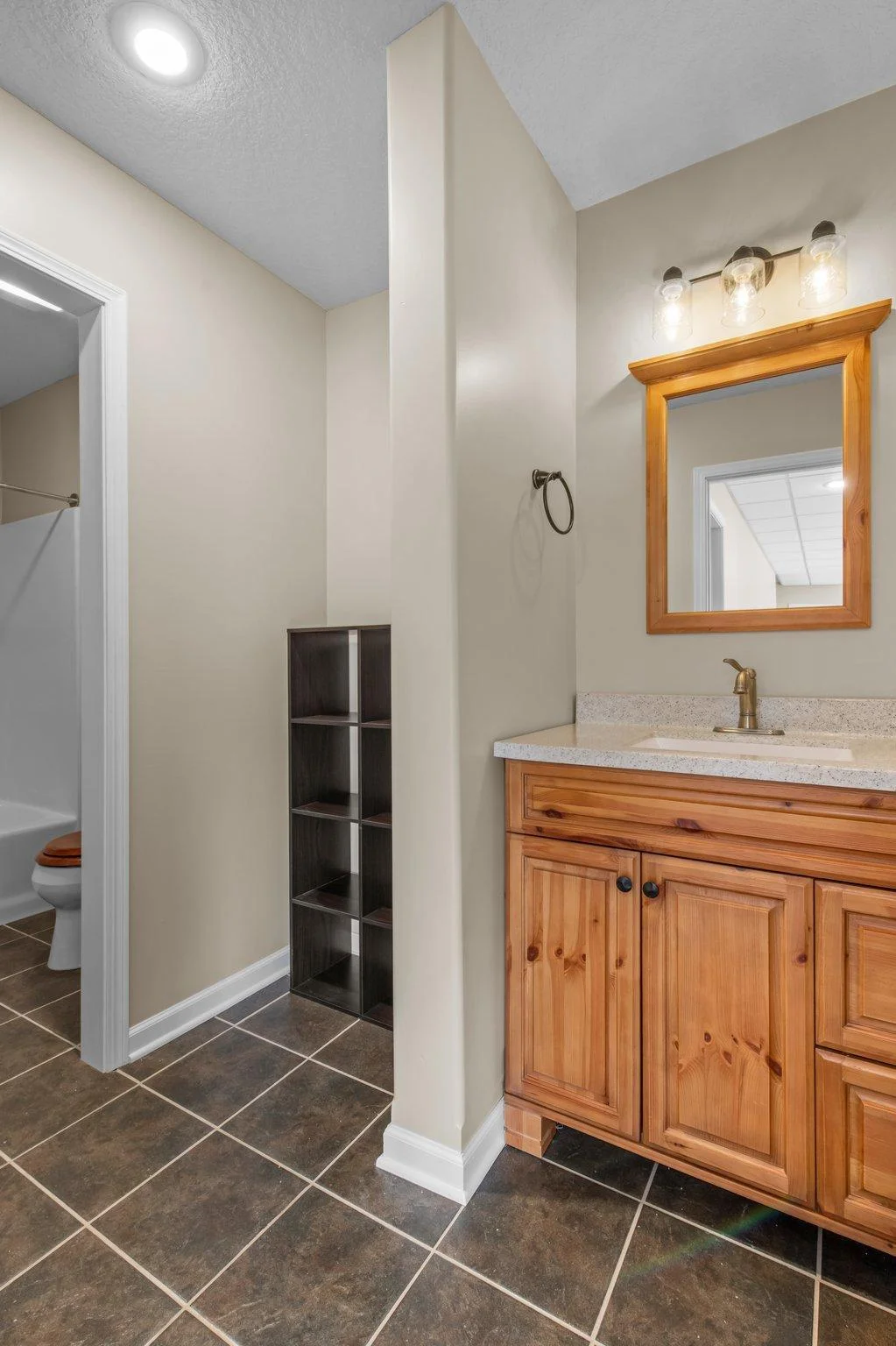 The lower level includes a full bathroom.