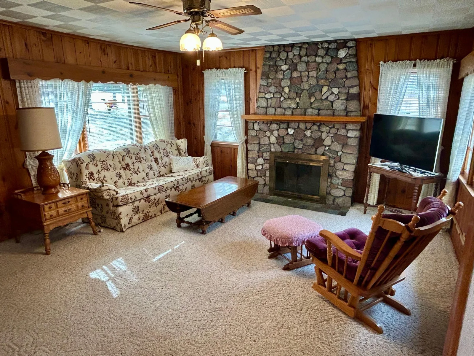 Living room with cozy stone fireplace