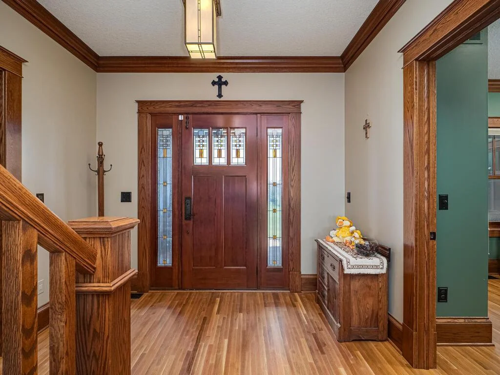 Spacious foyer with quarter sawn white oak hardwood