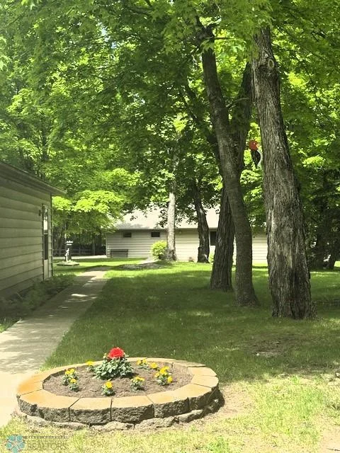 Lightly Wooded; Well-Manicured Yard; Steel Siding
