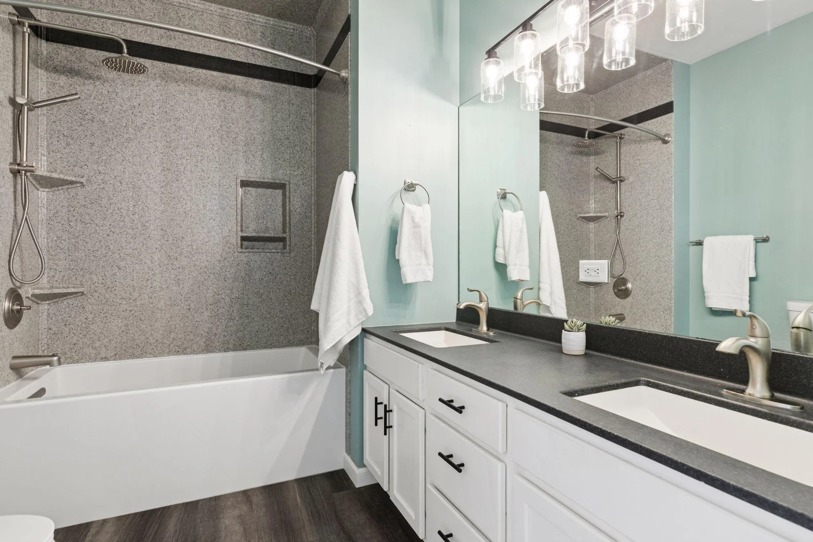 Upper level full bathroom with double vanity.