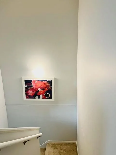 Tall hallway has big open feel and is great for displaying art.