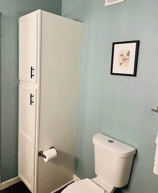 Linen cabinet in upper bath.