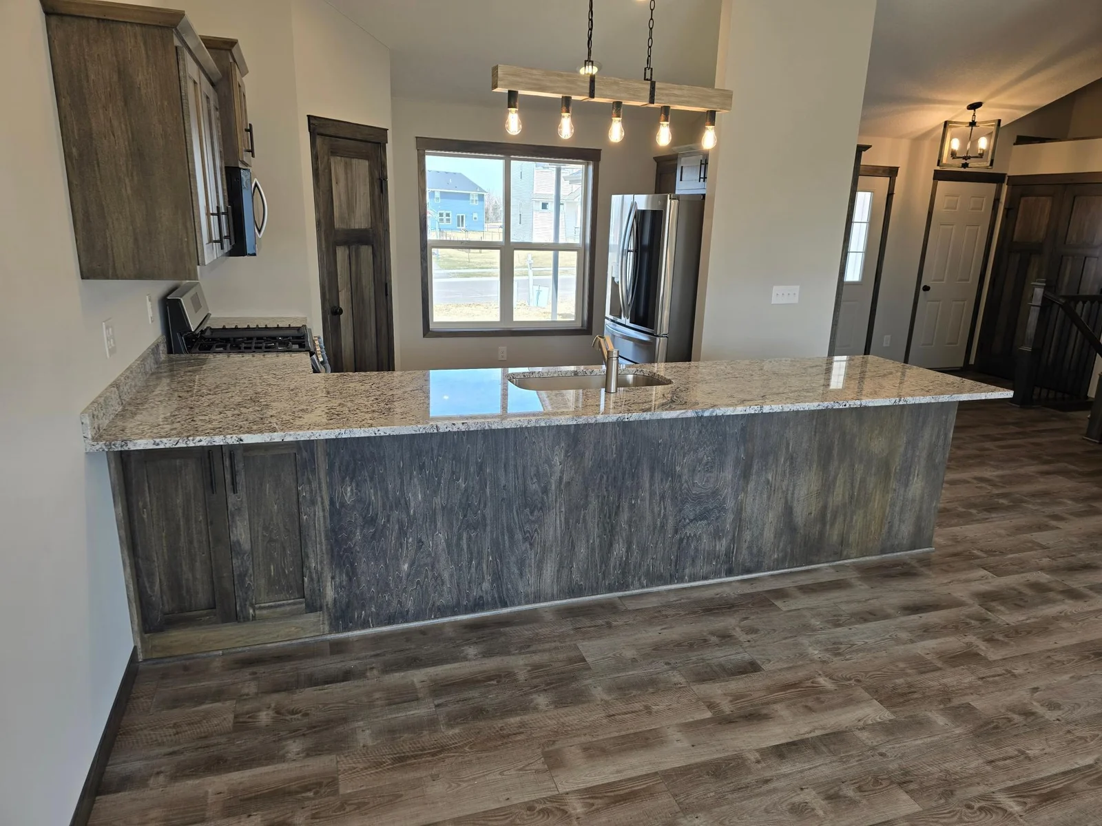 Another view of the kitchen area, large front facing window that brings in lots of natural light.