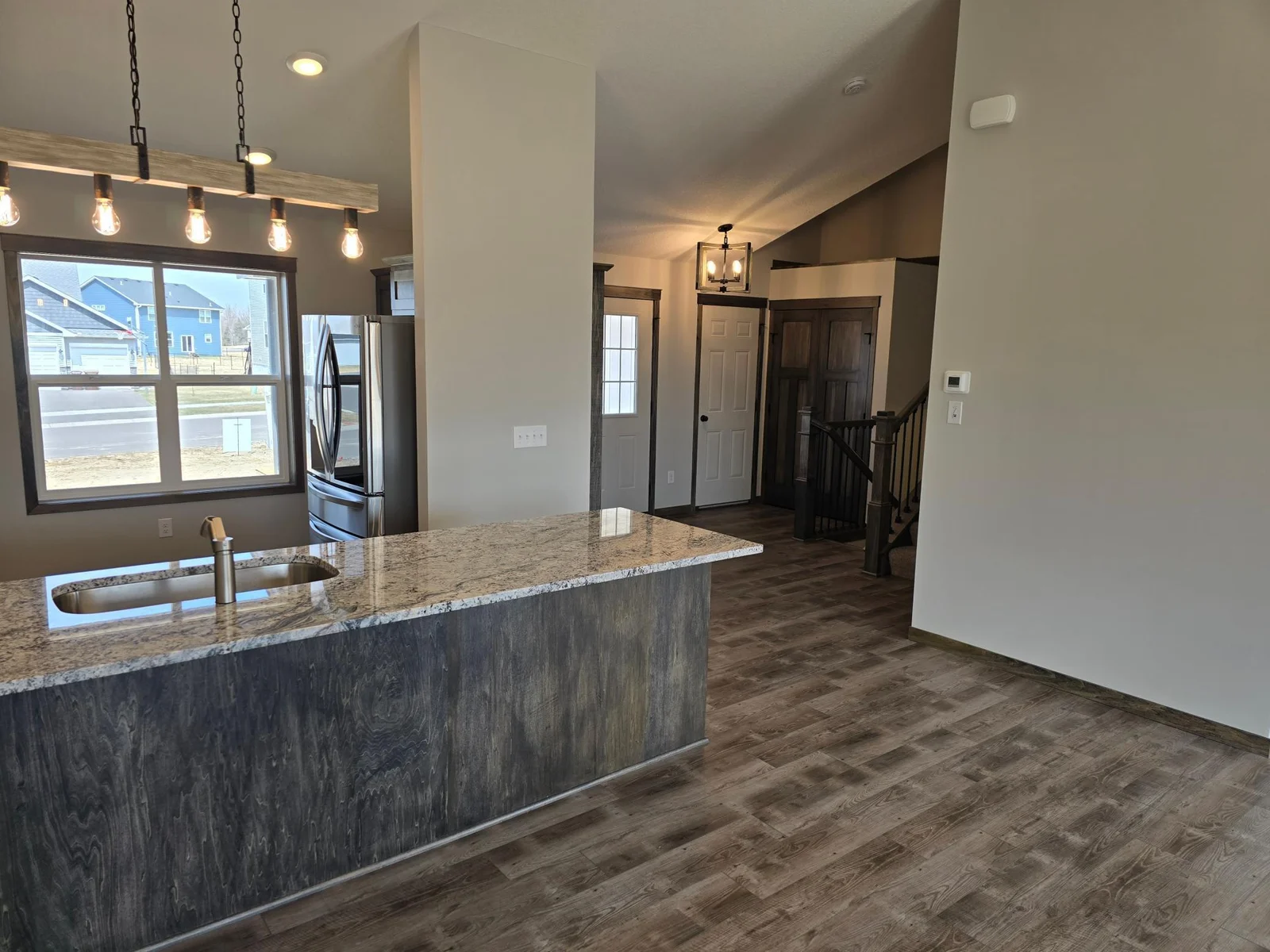 A view from the kitchen/dining area looking into the foyer area.