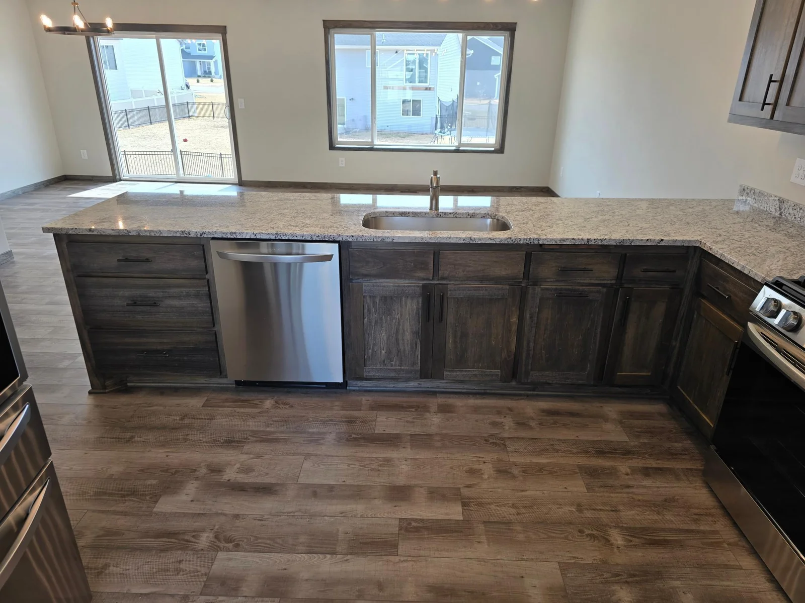 Nice bank of drawers next to the dishwasher. There is a built in garbage/recycling center in the base cabinet.