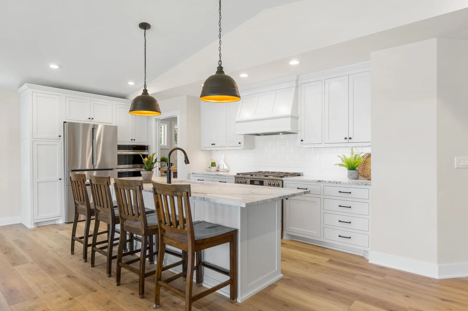 The Kitchen offers enameled cabinetry that features flat panel doors, under cabinet accent lighting, roll-out storage, pantry and large "eat-in" center island