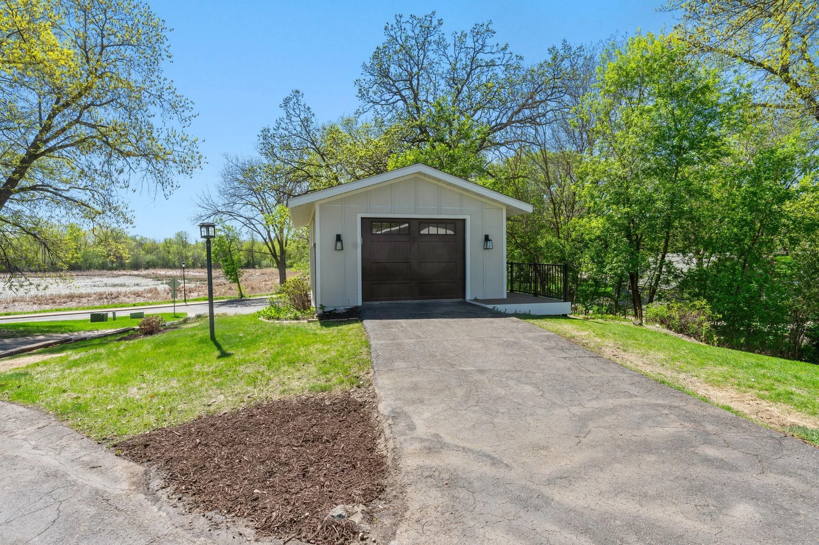 Bonus up-and-down garage out back opens up space for lake toys, hobbies, or a future hangout. New paneled doors and windows!