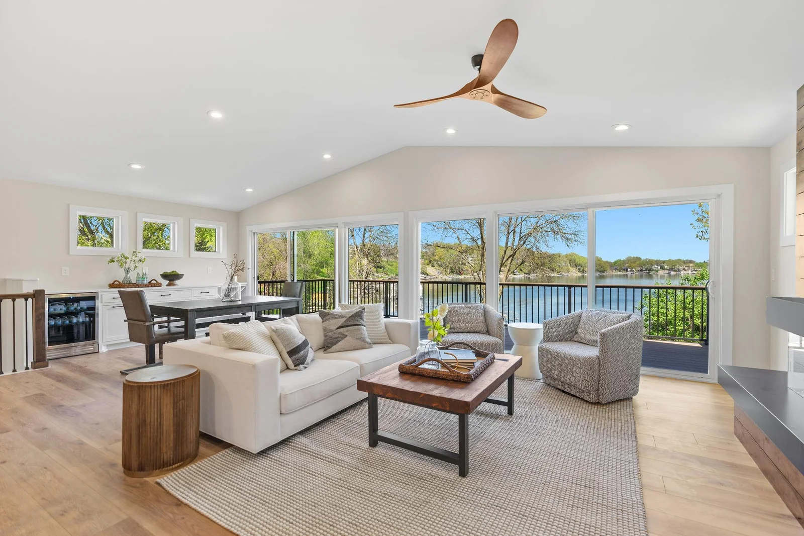 Oversized patio doors offers access to the deck and incredible views of Upper Prior Lake - vaulted ceilings w/ fan