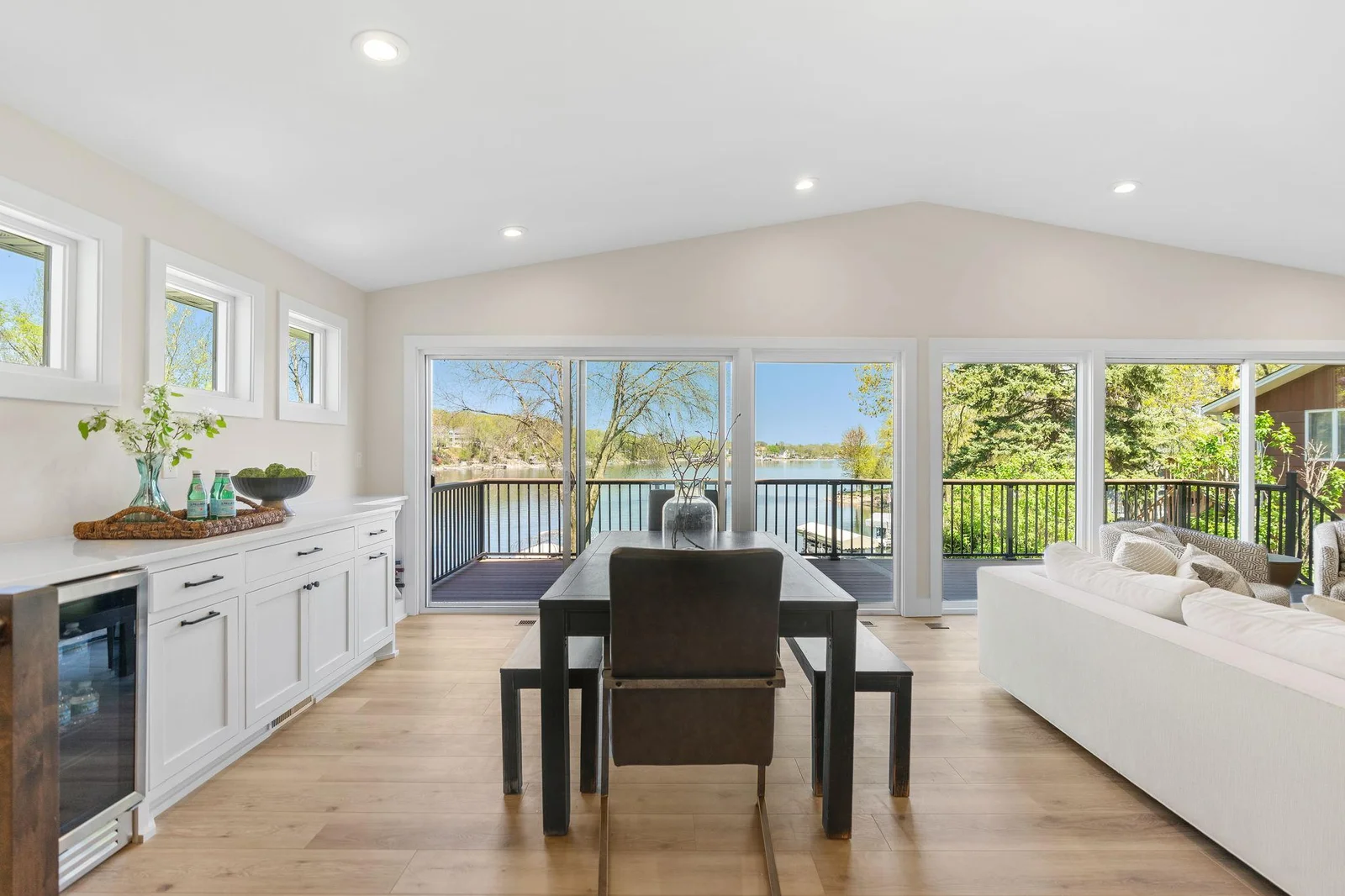 Dining Room features an enameled built-in cabinet that features storage, wine bottle display, beverage refrigerator and quartz countertops