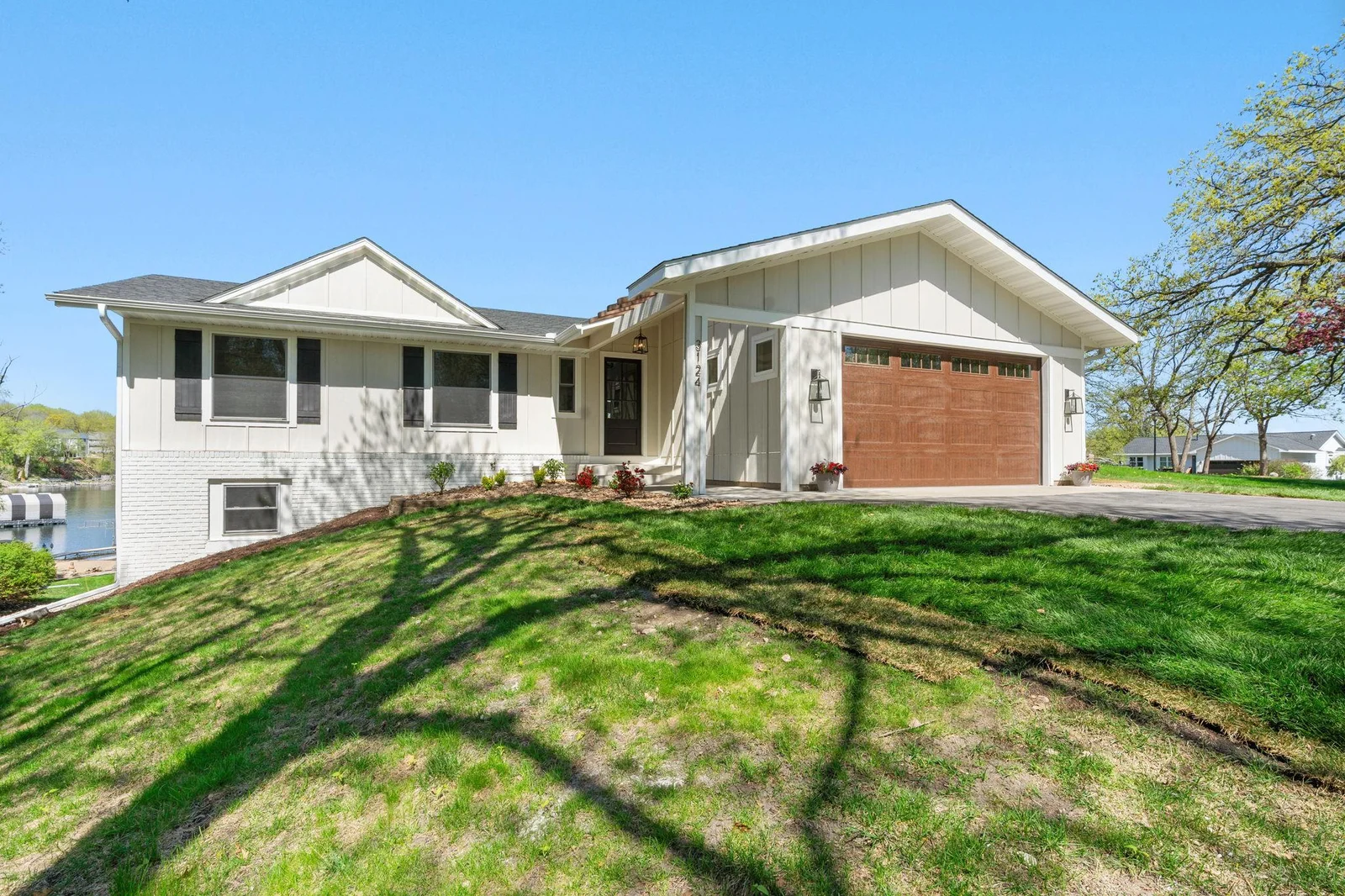 Home is wrapped in LP board &amp; batton and lap siding with charming accents
