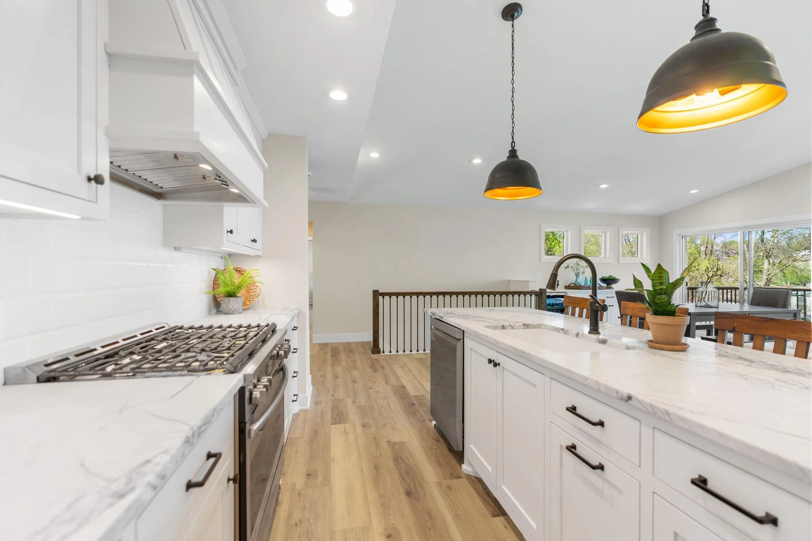 Natural quartzite countertops, quartz composite sink and subway tile backsplash - vaulted ceilings!