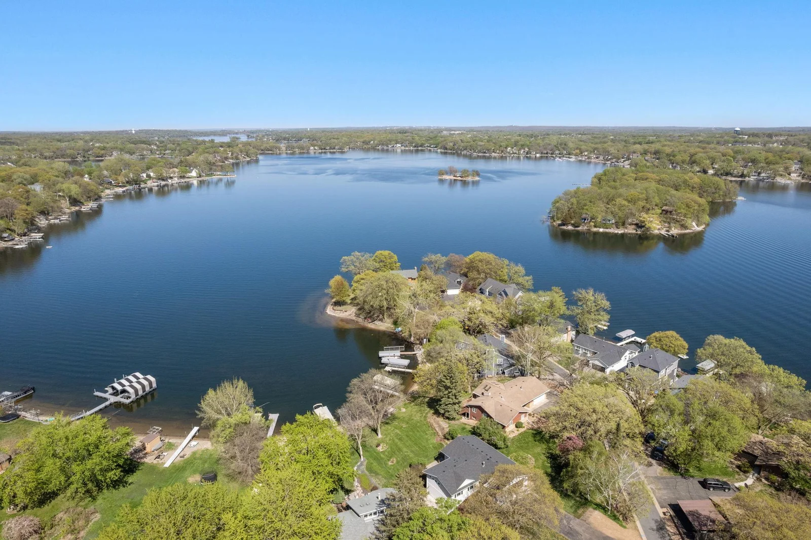 .67 acre lot with 66 ft of sandy lakeshore!