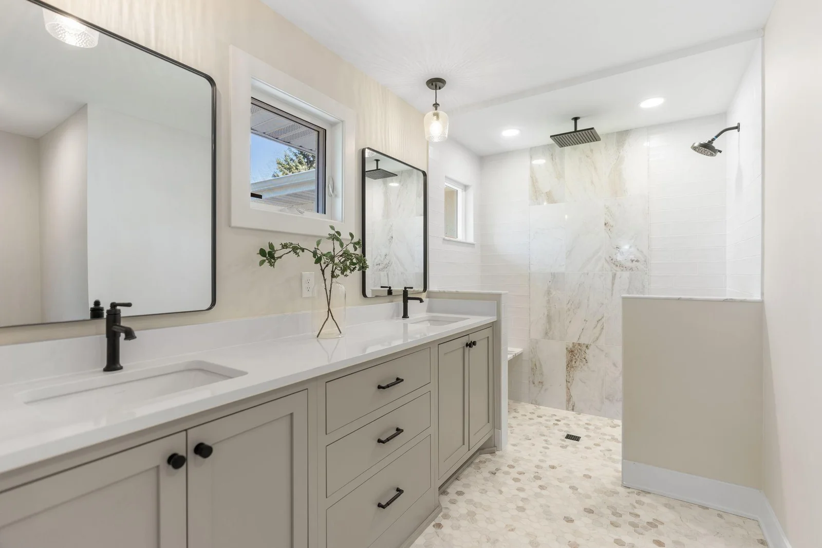 Master 3/4 private bathroom has a generously sized vanity cabinet with quartz countertops and dual sinks