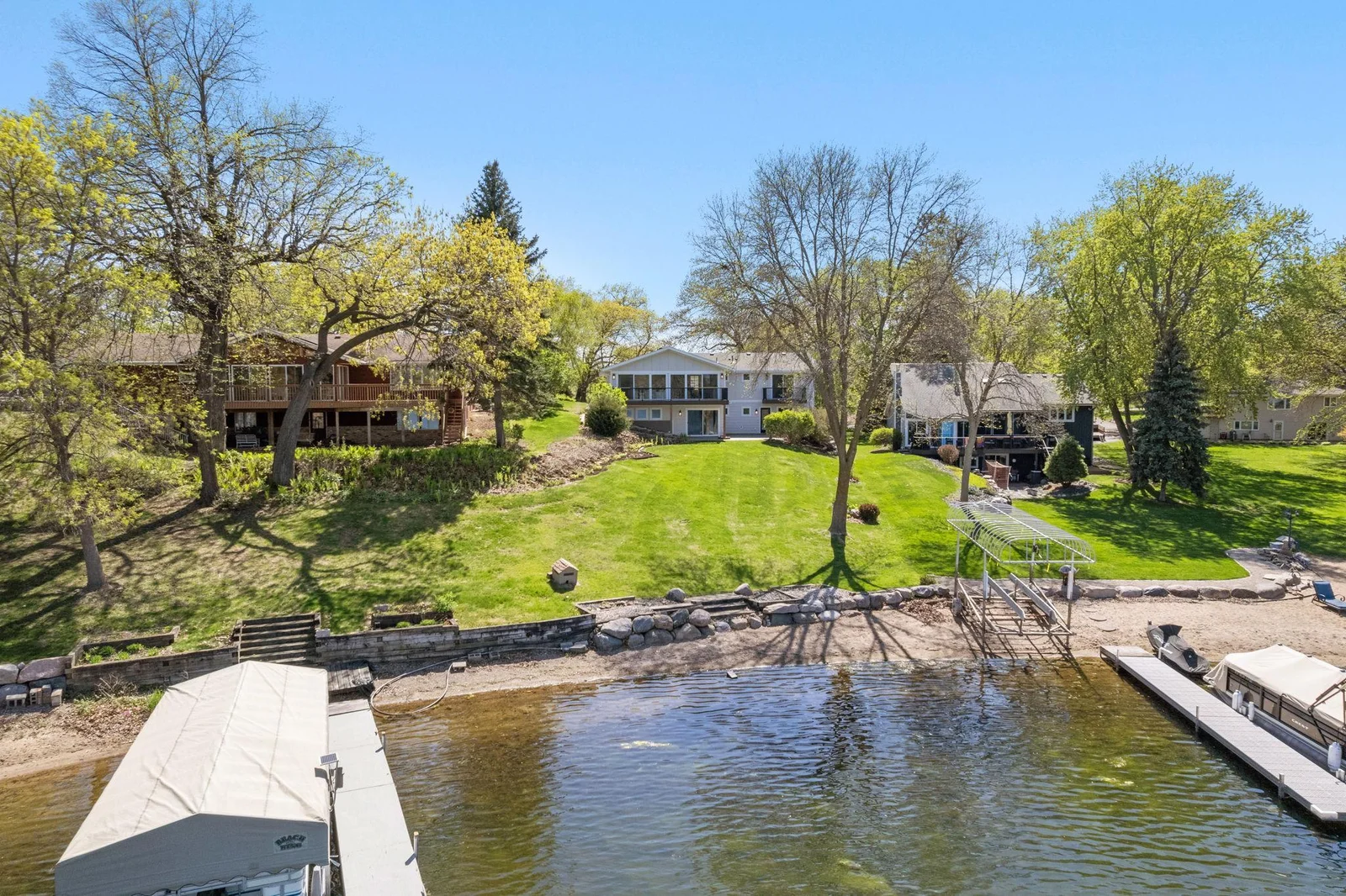 Home perfectly situated on a .67 acre lot and offers 66 ft of sandy lakeshore on Upper Prior Lake!