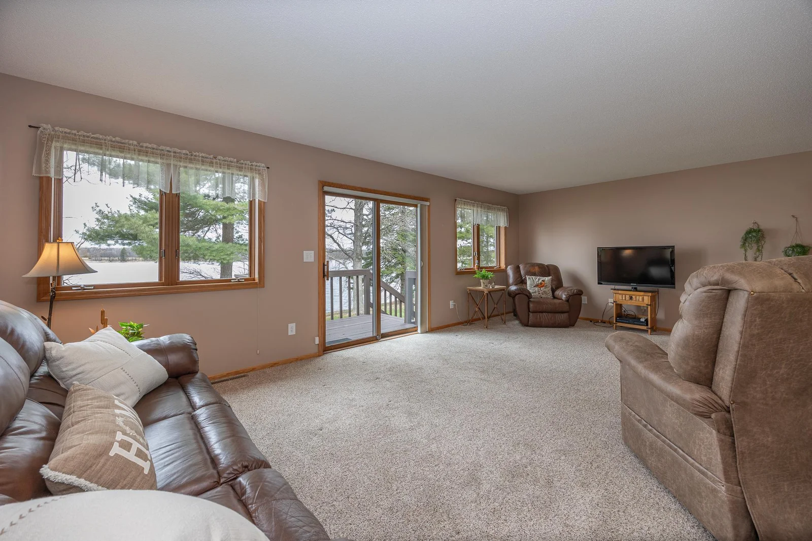 Large living room looks over the lake.
