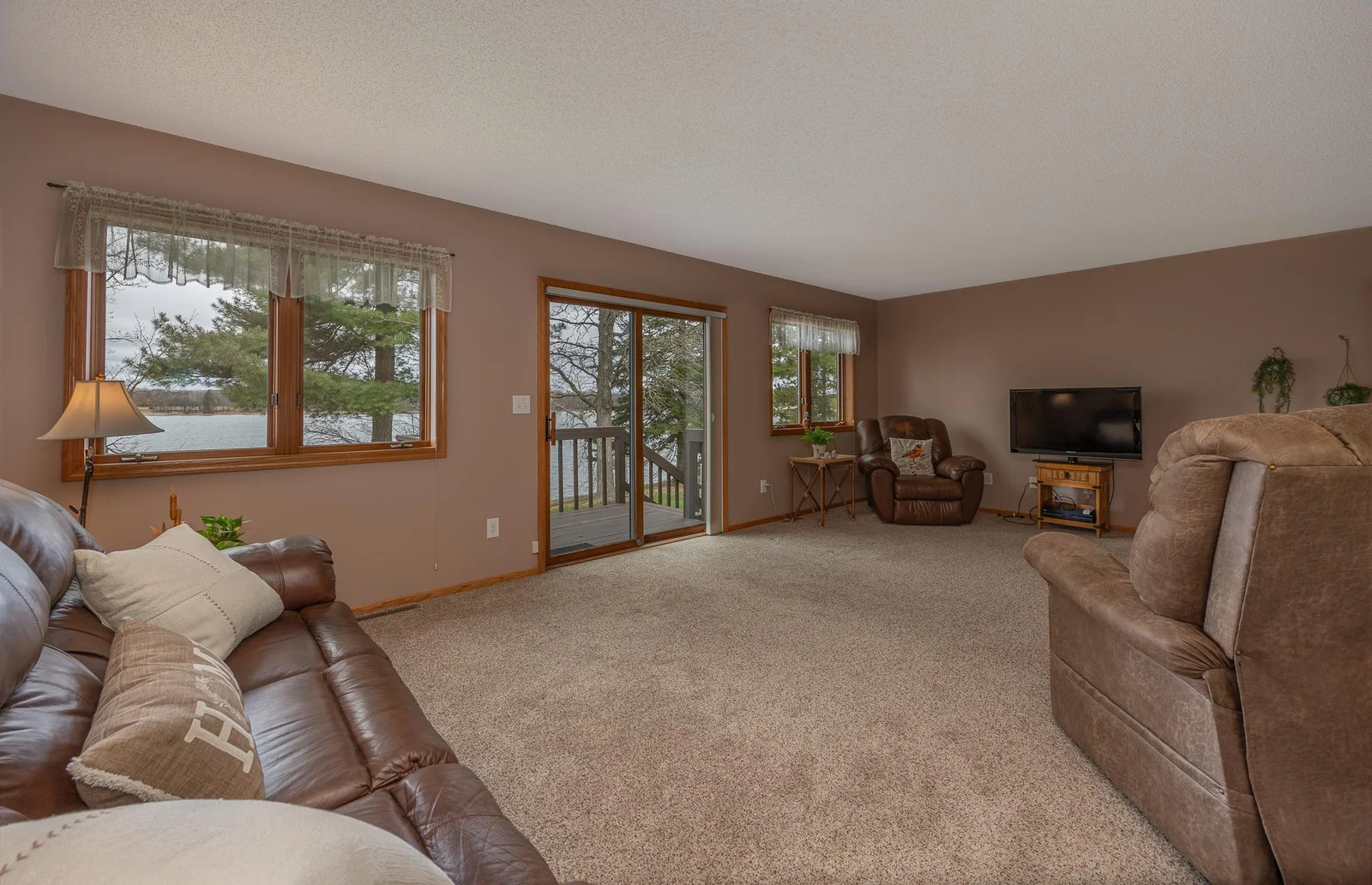 Living room with a patio door to the lake.