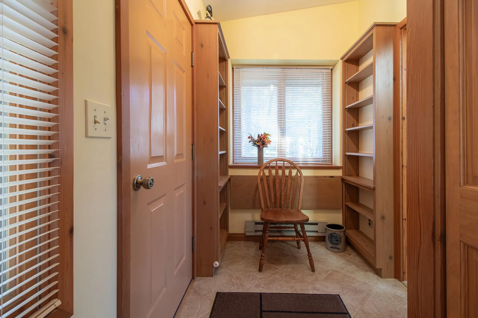 Great 6x12 mud room with all your storage needs - love the natural light from both windows!