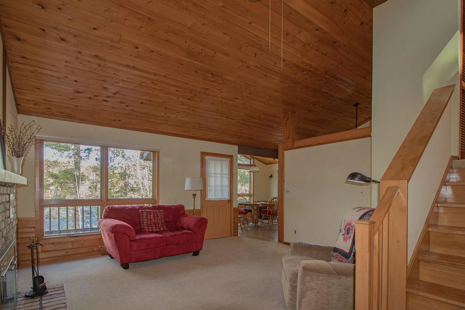 Large windows in living area with beautiful lake views