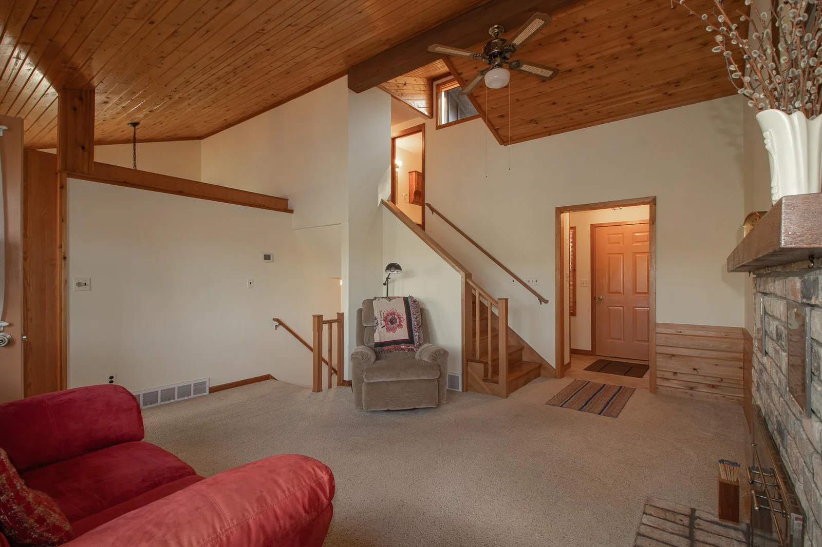 Living area - stairs to lower walkout level and stairs to upper level - mudroom entry off living area