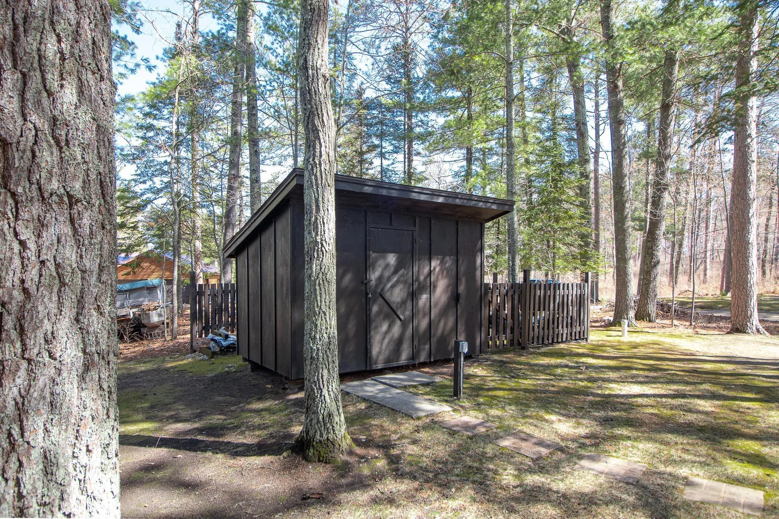 Shed with fenced in additional outside storage