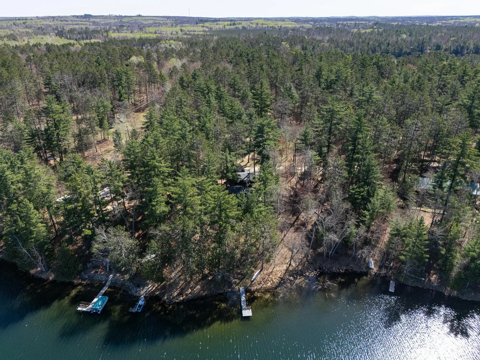 A total of 3.82 acres including lot w/pole barn across from the road
