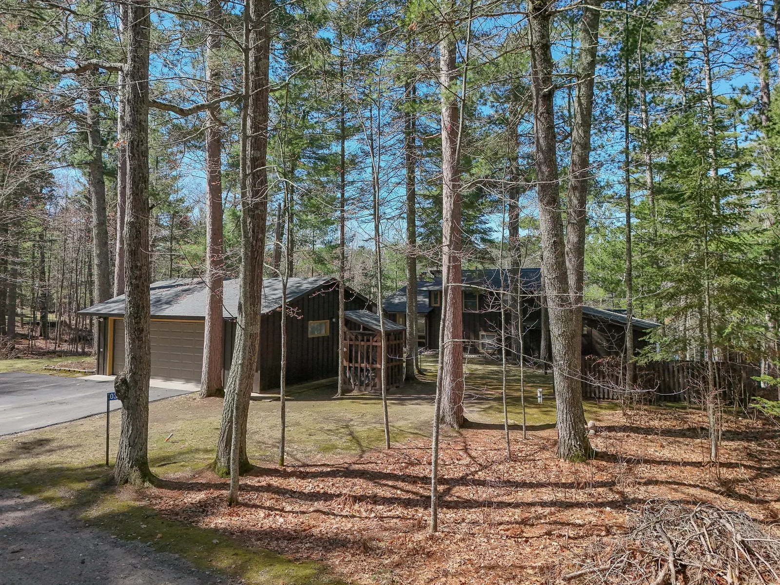 Wood shed is to the right, next to the garage