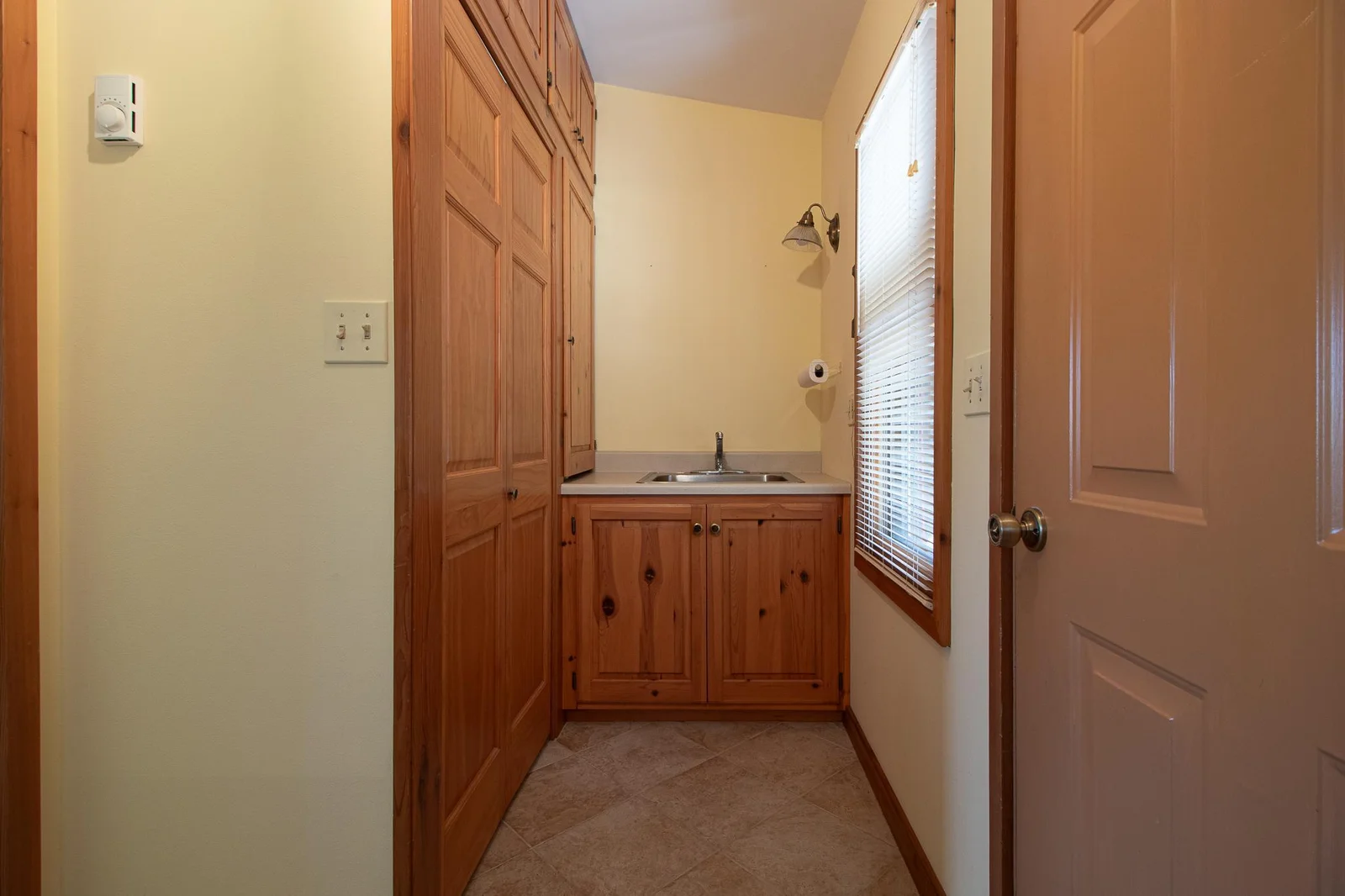 More storage in mud room -also a sink for a quick wash up after working outside