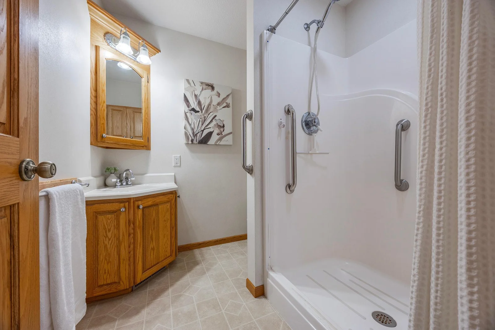 This 3/4 bath is perfectly situated off the hallway, ideal for guests or family use