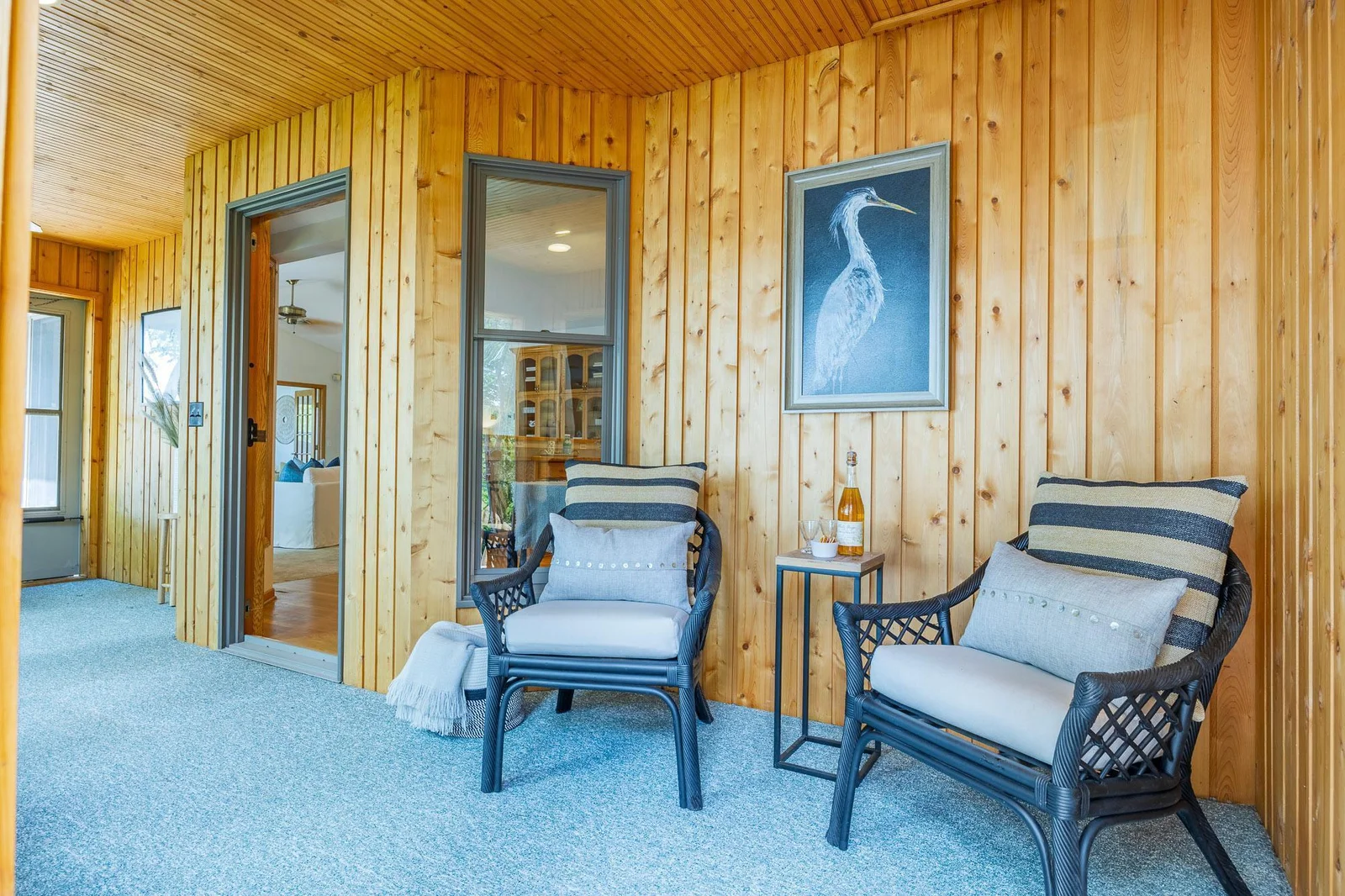 Enjoy morning coffee or evening wine on the porch with peaceful lake views—your perfect spot to relax and unwind