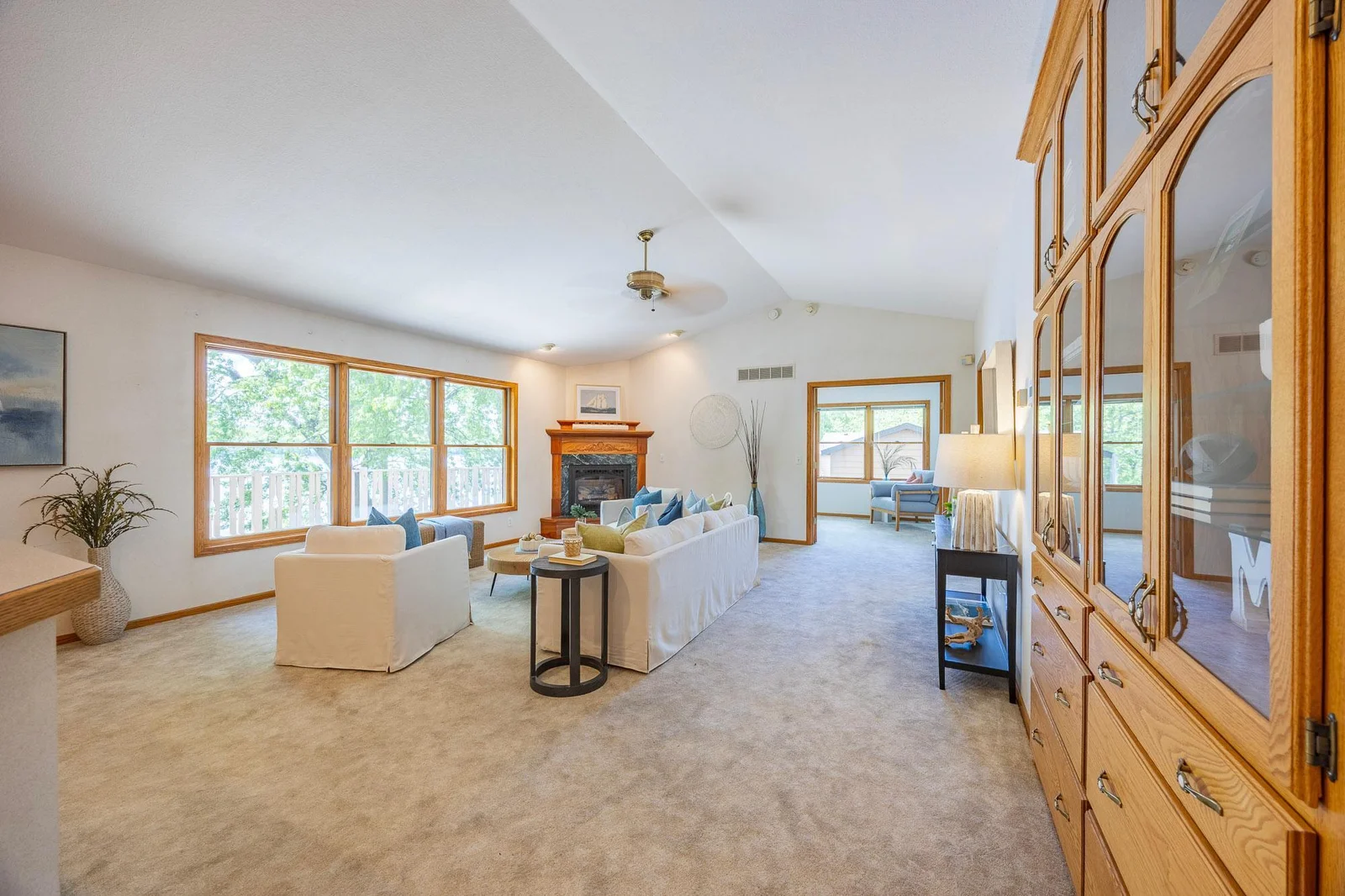 Natural wood tones, vaulted ceilings, and abundant sunlight blend beautifully to bring the outdoors in, making this room a true sanctuary