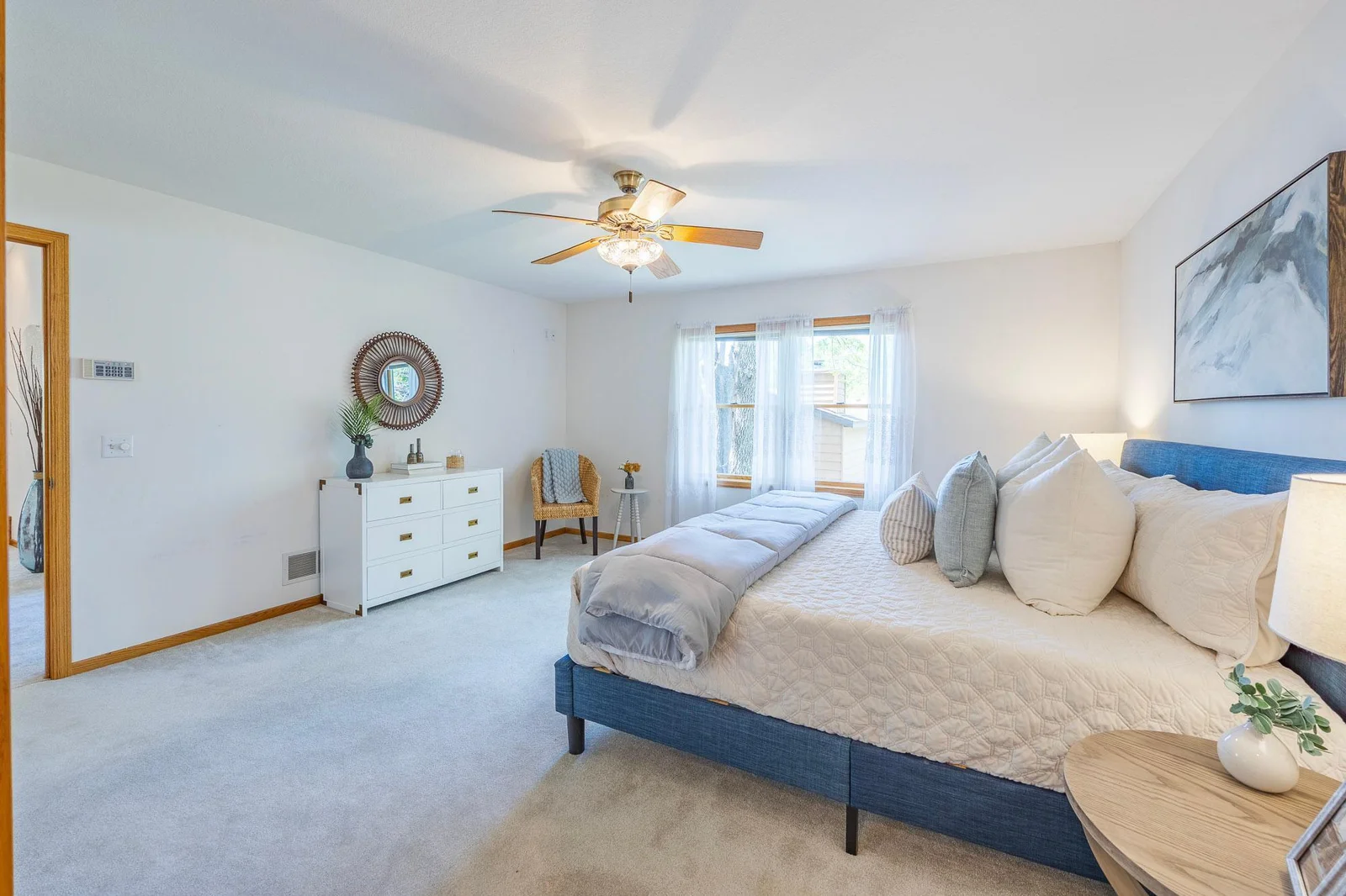 The spacious Primary Bedroom offers a warm and welcoming atmosphere