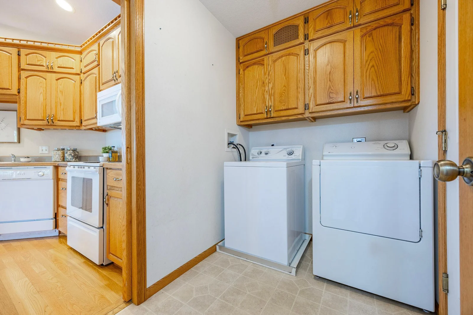 Main floor laundry area with a pocket door for soundproofing
