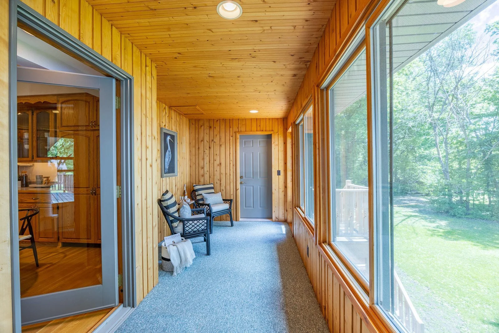 Acces the deck, backyard or garage directly from the three-season porch!