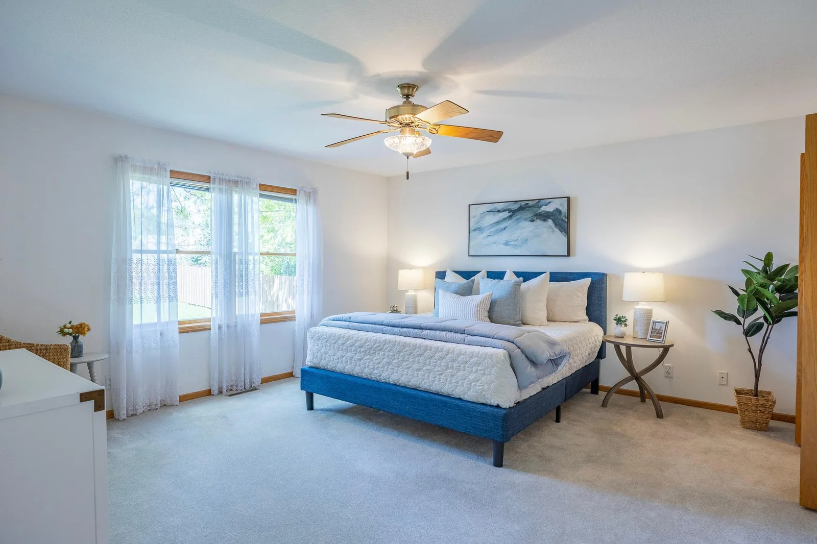 Large windows fill the Primary Bedroom with natural light
