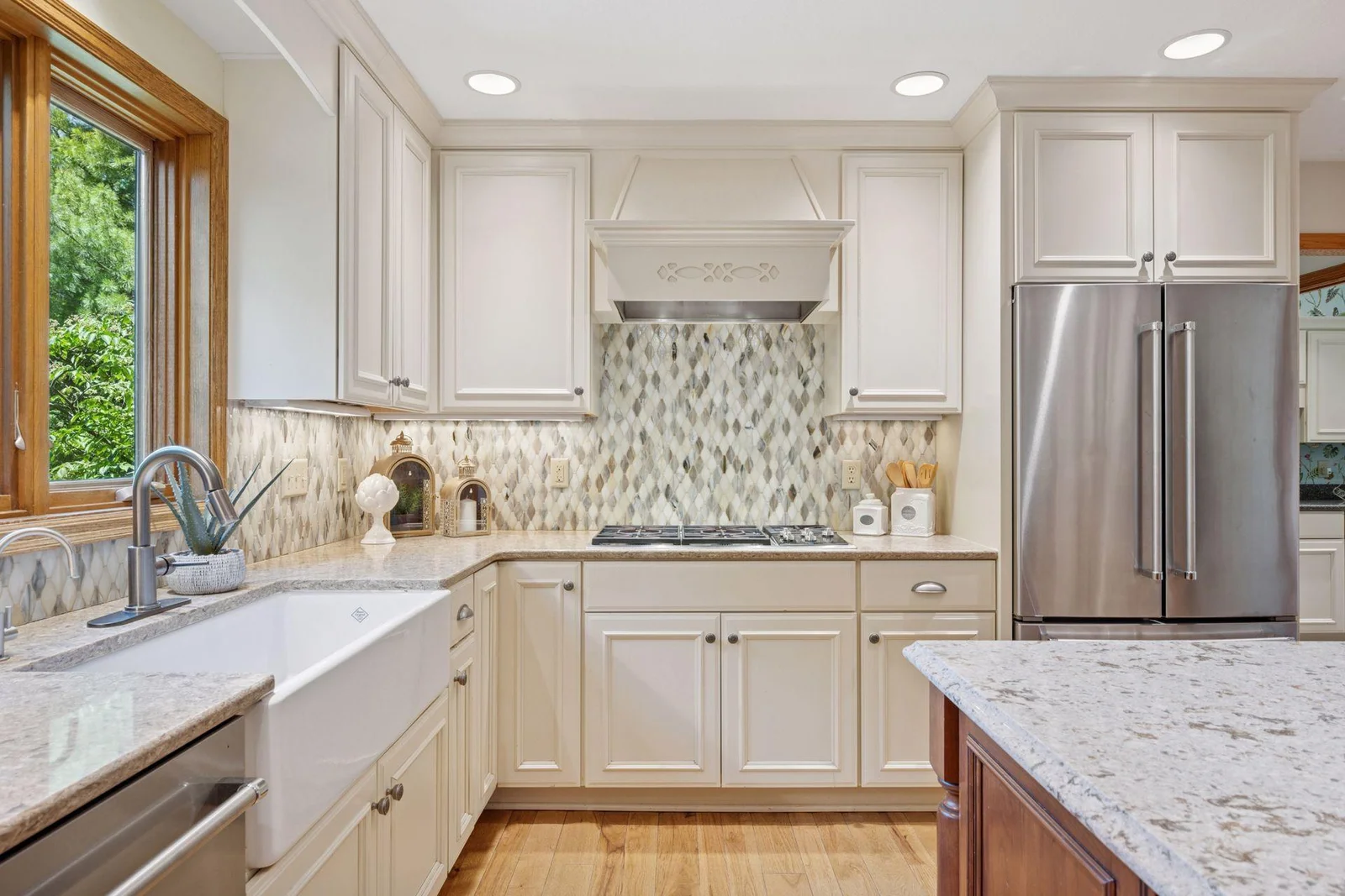 Kitchen window looks out to private backyard and lake views.