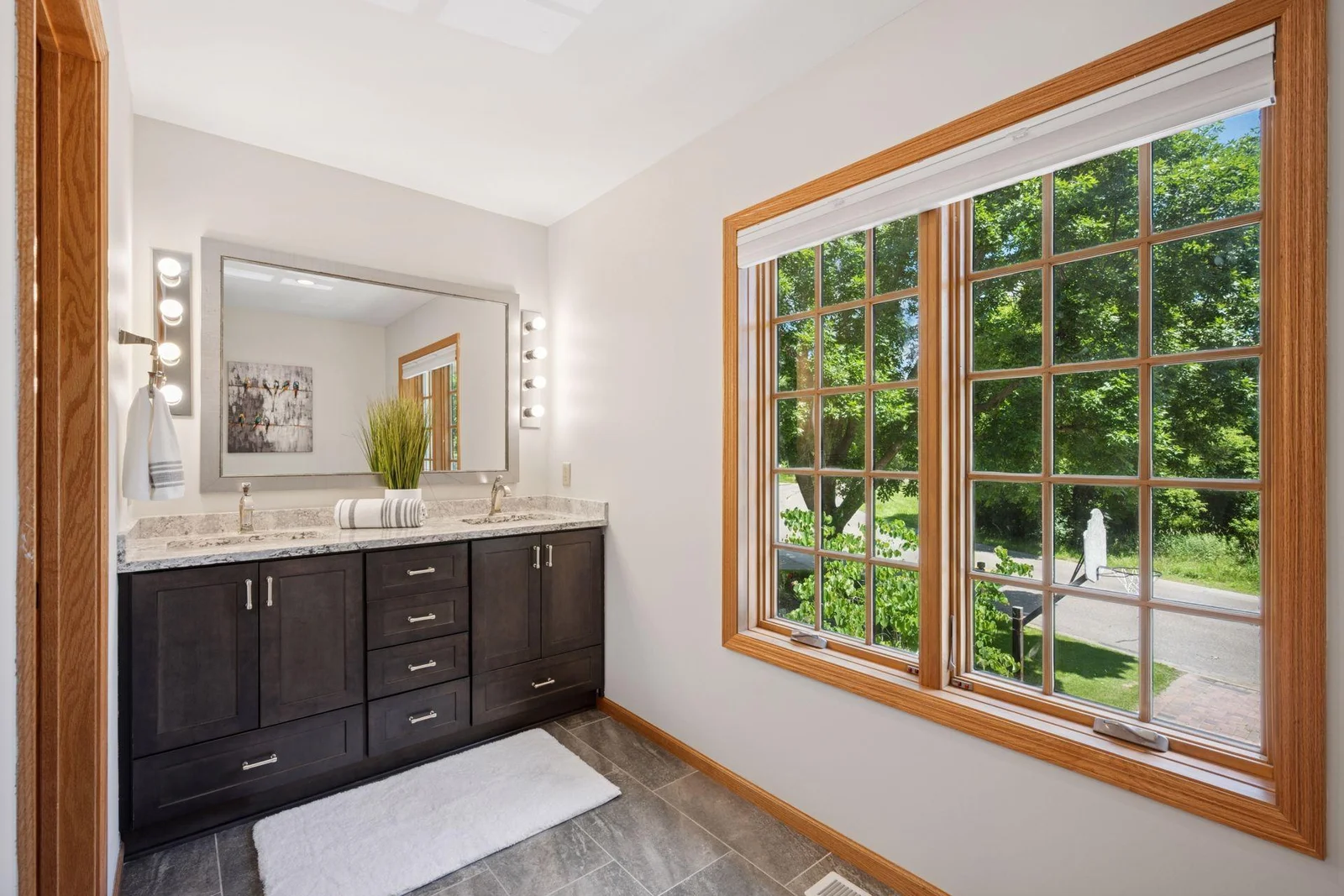 Upper level 3/4 bath with water closet, double sinks and a separate walk in shower.  Accommodates a large family very swiftly while preparing for the day.