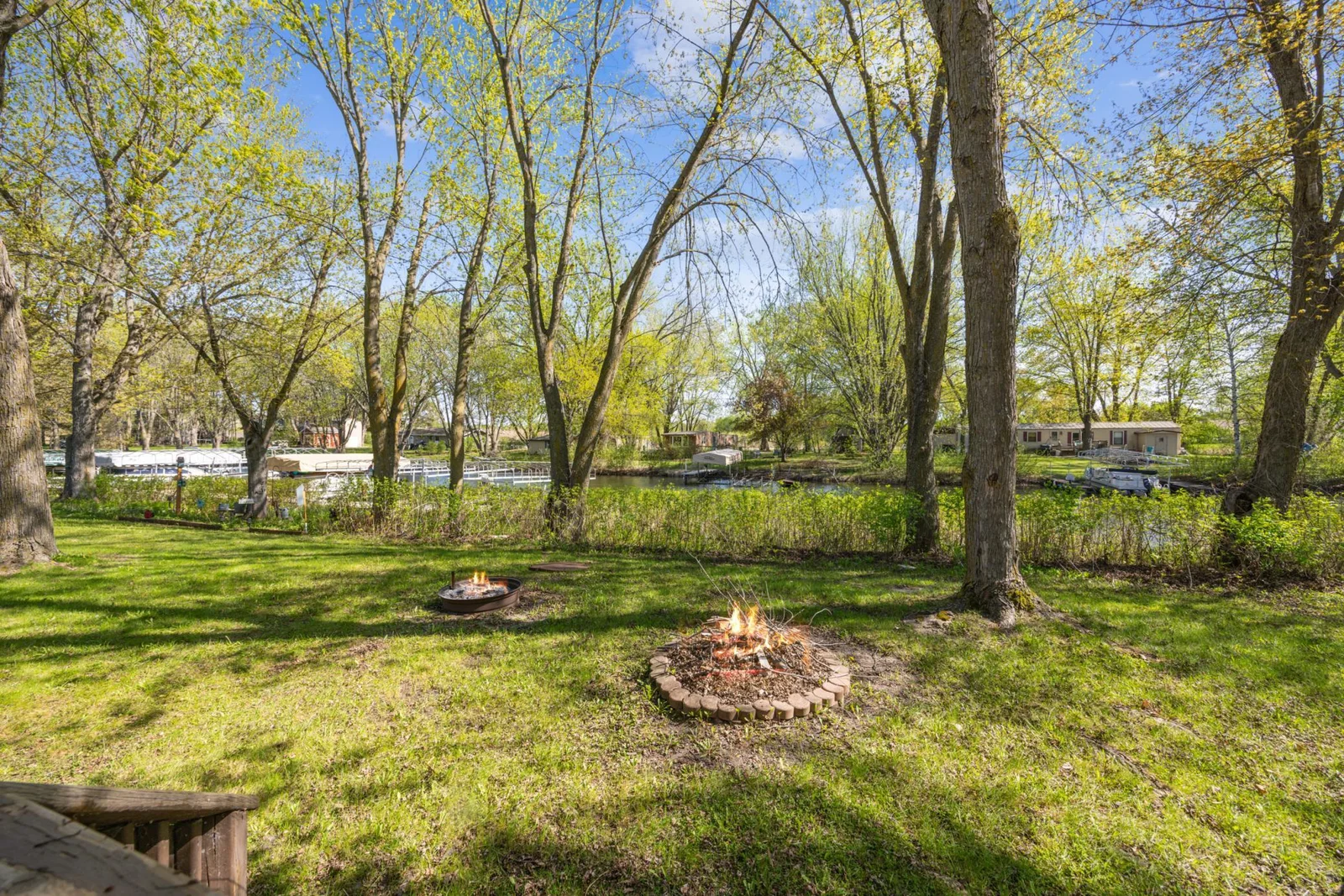 The association includes lawn care, water/sewer, beach access, dock and shared amenities like a clubhouse and in-ground pool!