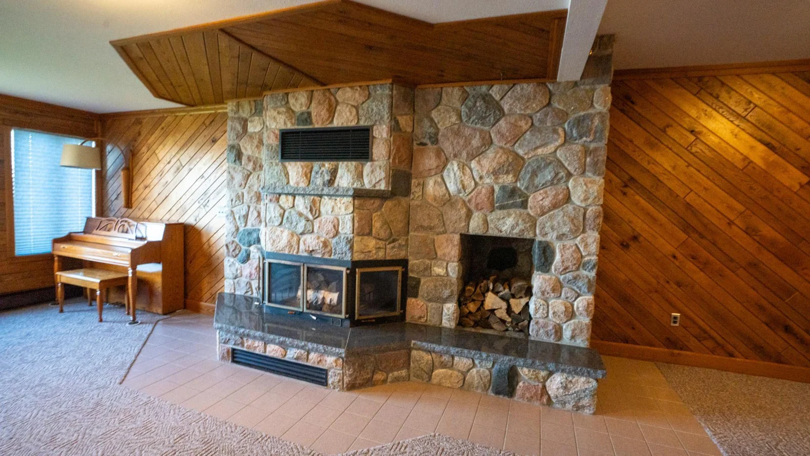 Basement level stone fireplace