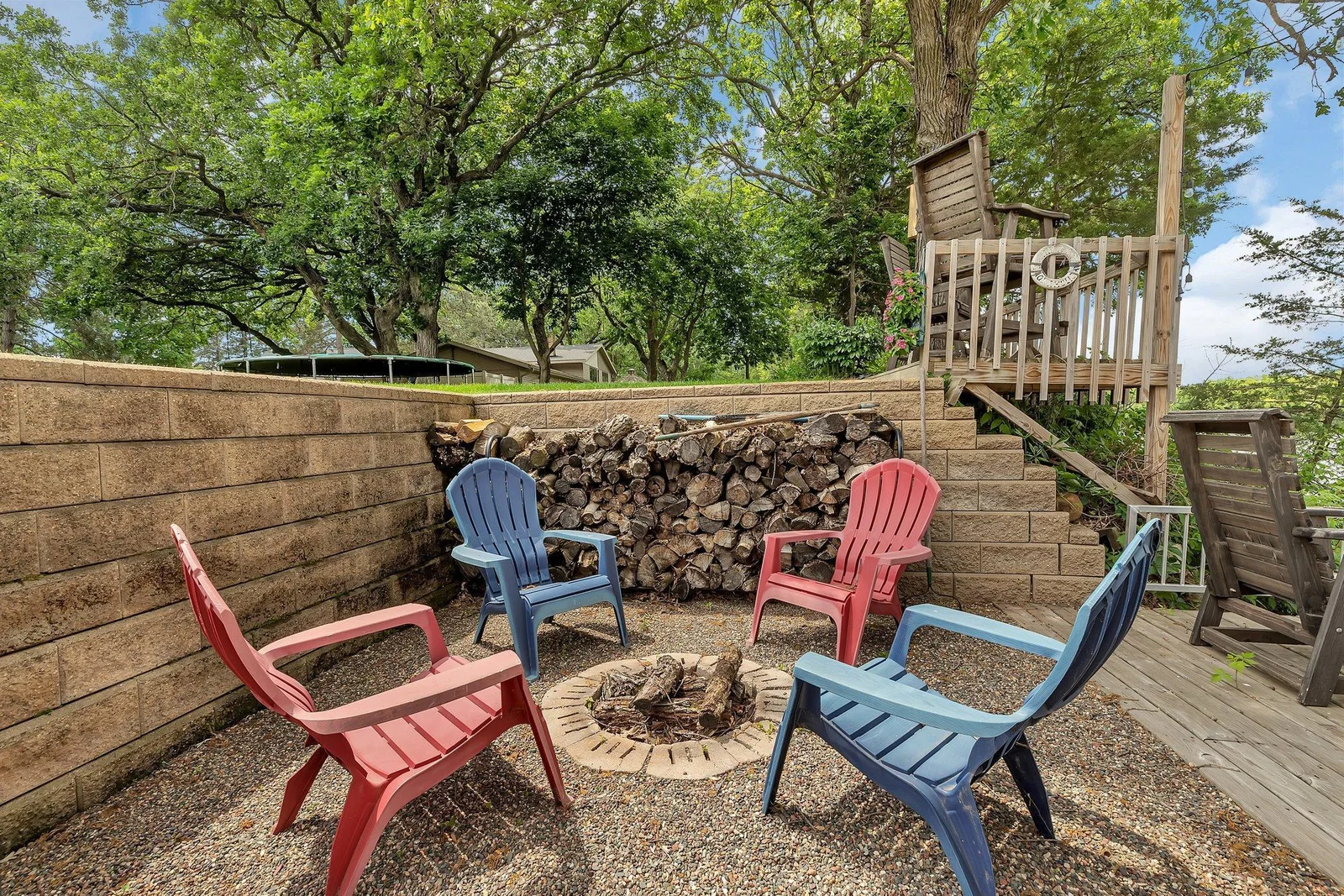 Stone wall encloses a private seating area.
