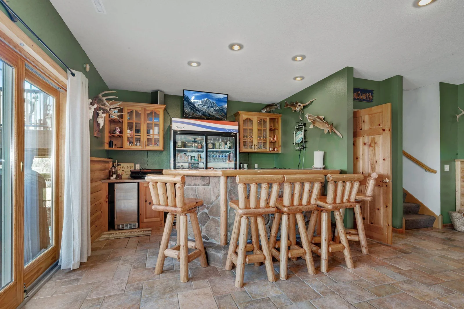 Full bar with double refrigerator.
