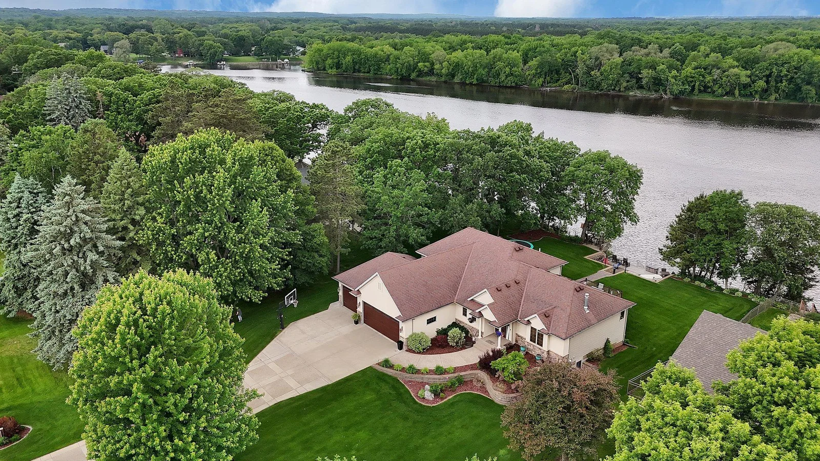 A fresh perspective on your dream space.  Drone view showcases the full property layout of this destination river estate at Ferry Point.