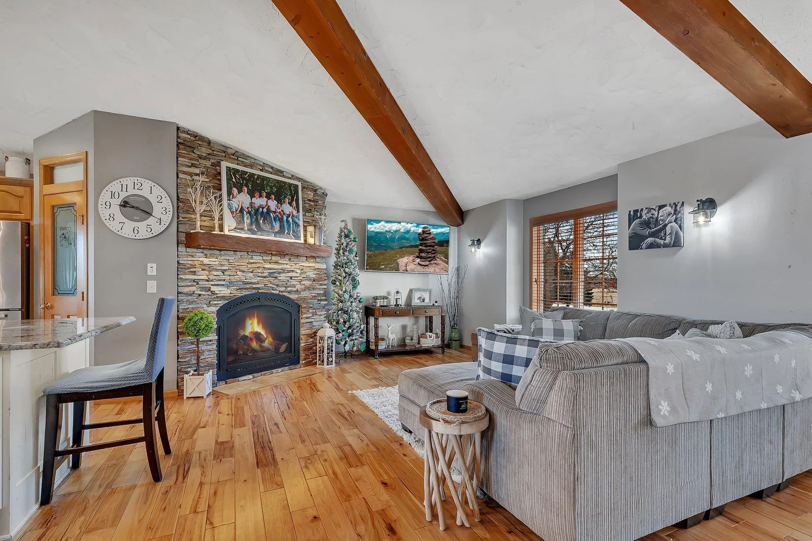 Natural light floods this home.  Acacia hardwood brings 3 main spaces into one great room.