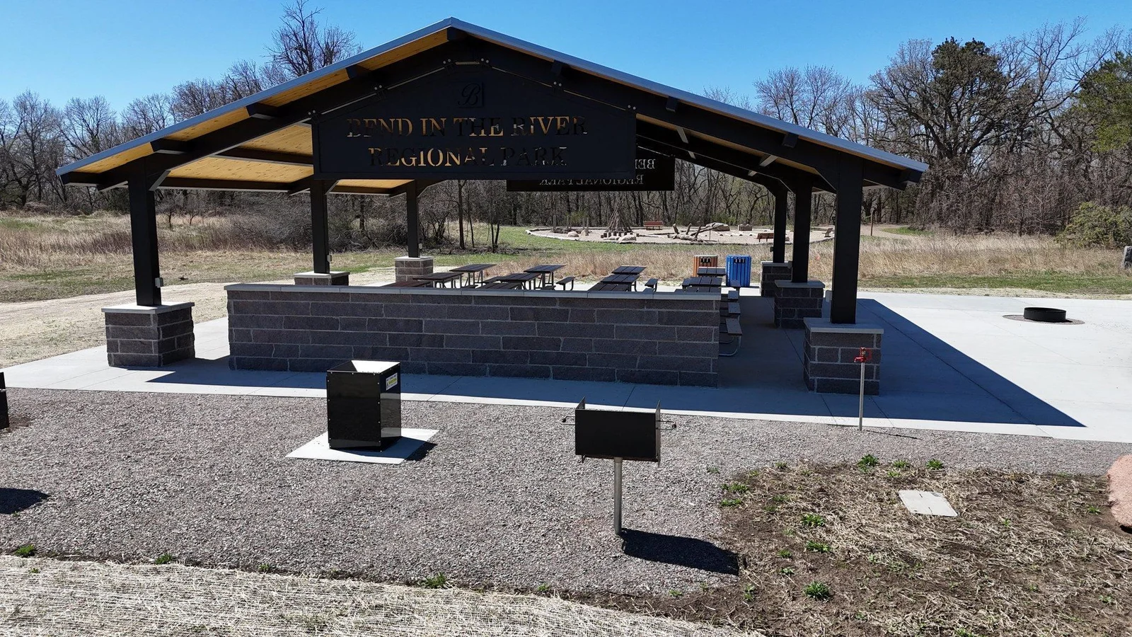 Enjoy a picnic, the park, and endless walking trails. Photo  91-103 Features the amenities of Bend in the River Park