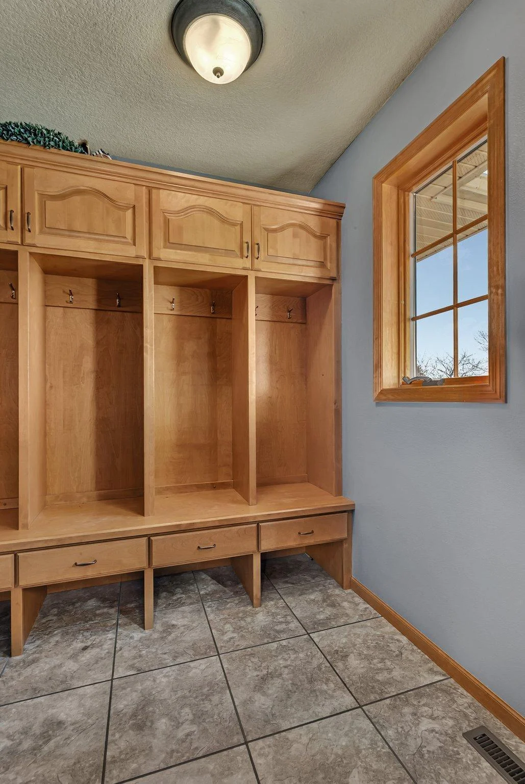 Built in storage and lockers in mudroom off the garage