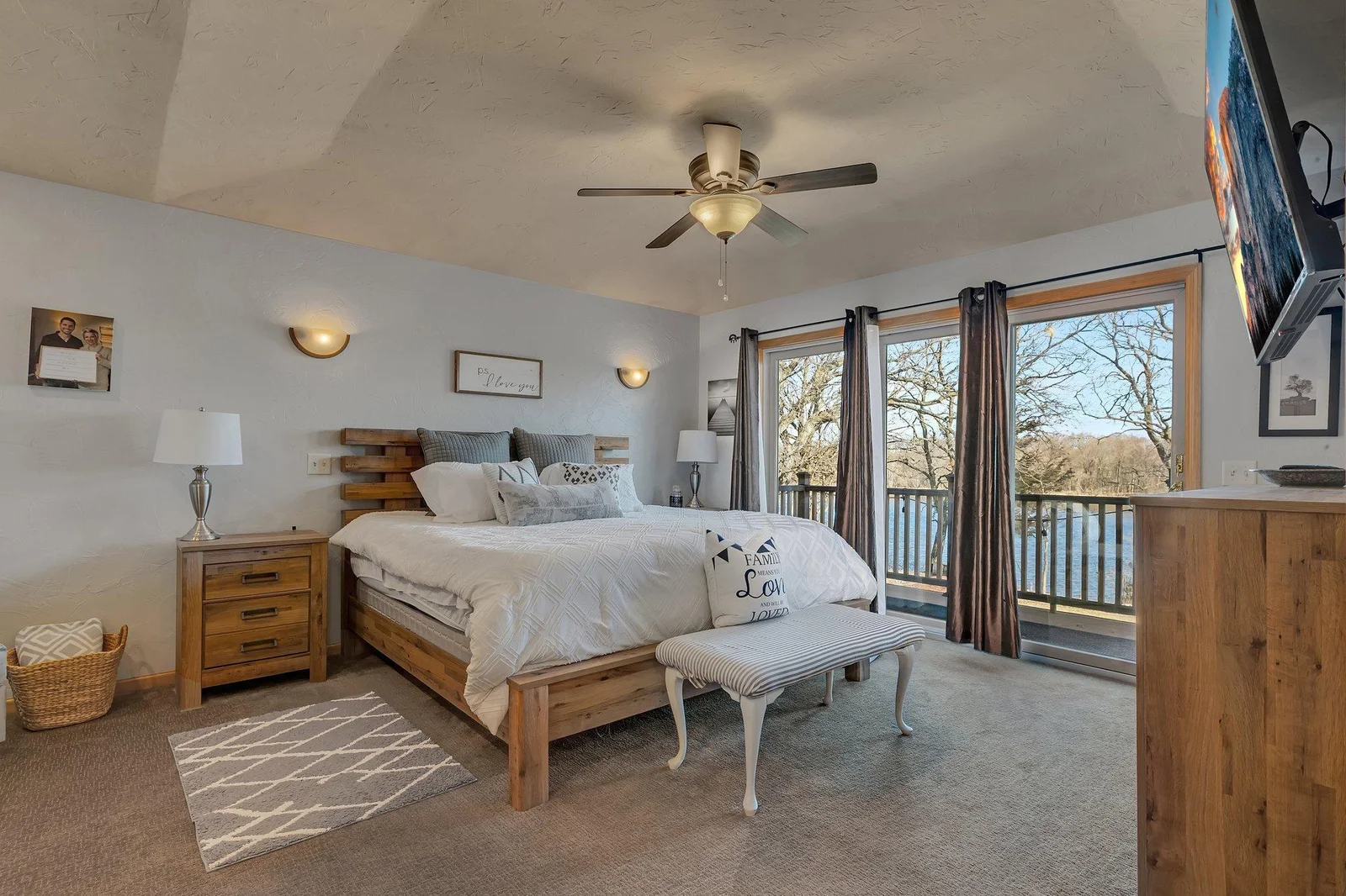 Wake up a river view in the primary bedroom.