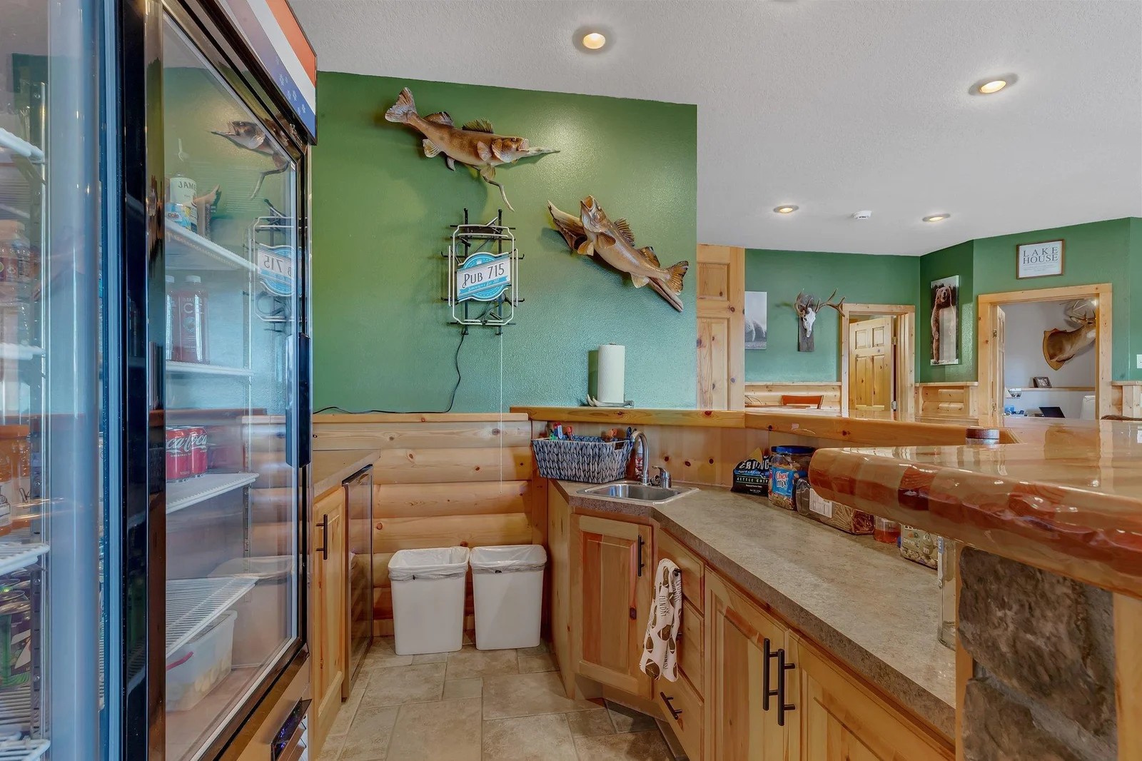 Wet bar features a fridge, sink, and place to prepare your drinks and snacks.