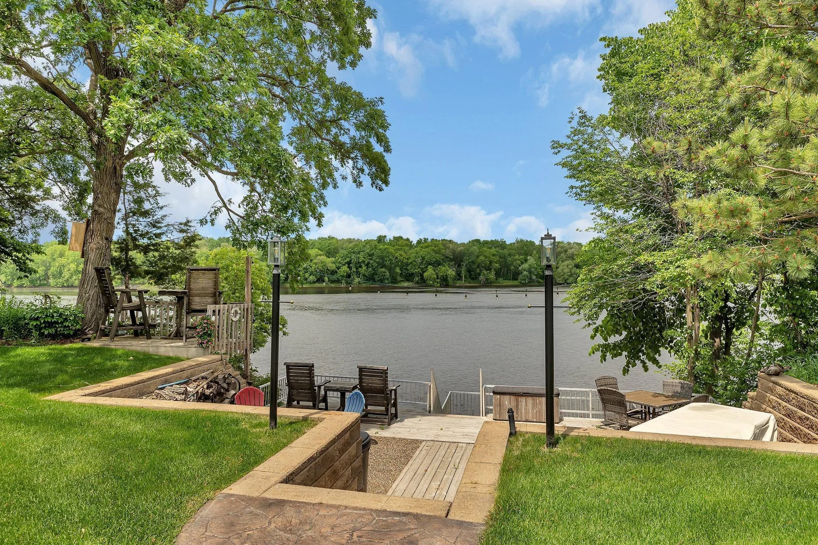Tranquil river views from your own backyard oasis.  198 acre park across the river- Mississippi River Park.